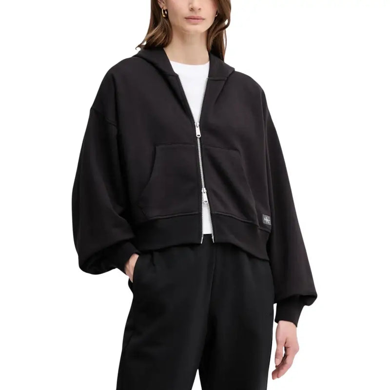 Calvin Klein Jeans women black hooded zip sweatshirt with cropped fit, zipper front, and two side pockets