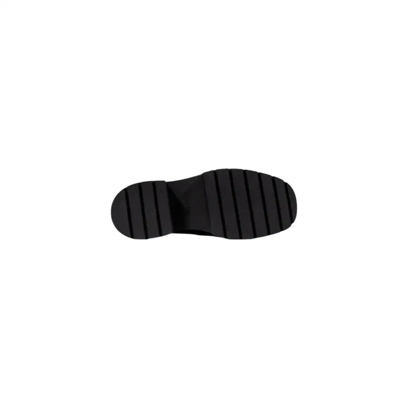 Calvin klein jeans women black wool slip on shoes showing black rubber sole with chunky ridged tread pattern