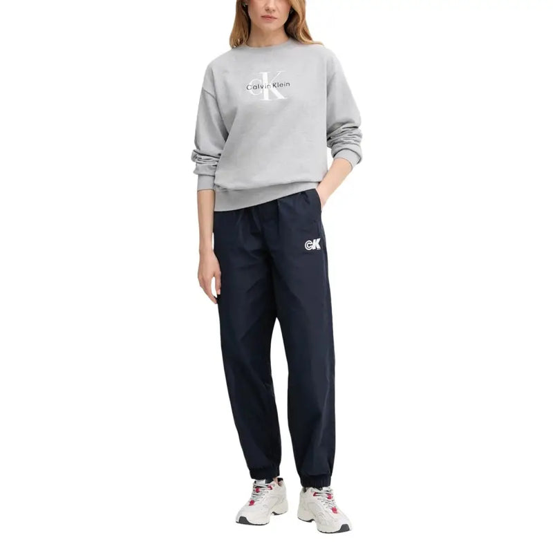 Calvin Klein gray sweatshirt with white CK logo and navy joggers