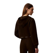 Back side of a dark brown cotton cropped hoodie with a subtle white calvin klein logo on the lower back
