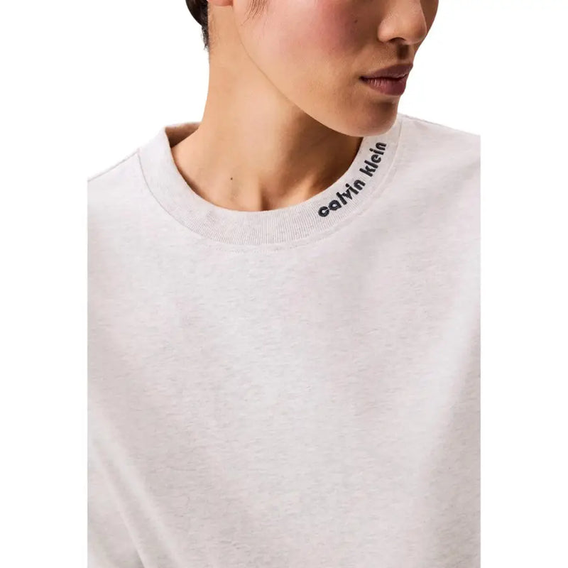 White calvin klein crewneck sweatshirt with black logo embroidered along ribbed neckline for casual wear