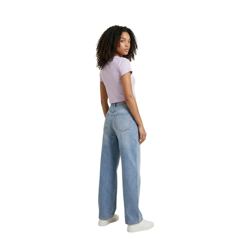Back view of light-wash wide-leg denim jeans paired with calvin klein jeans women lilac cotton round neck t shirt