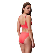 Coral pink calvin klein bikini set with thin straps and waistband branding in calvin klein jeans women orange bralette beachwear