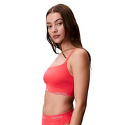 Vibrant coral calvin klein jeans women orange bralette with thin straps and sleek modern design for beachwear