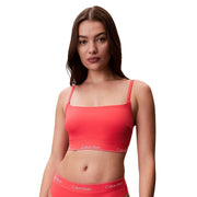 Coral pink Calvin Klein cropped bralette with thin straps and white logo waistband for women beachwear