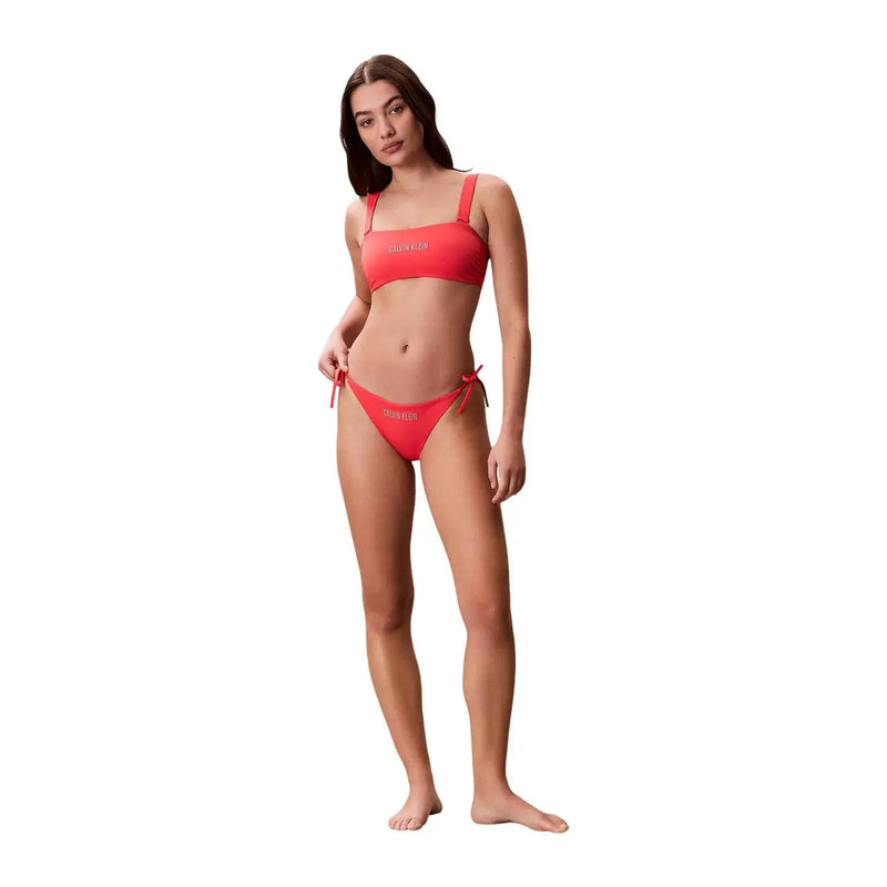 A vibrant coral calvin klein jeans women orange striped bikini set with bandeau top and matching side tie bottoms