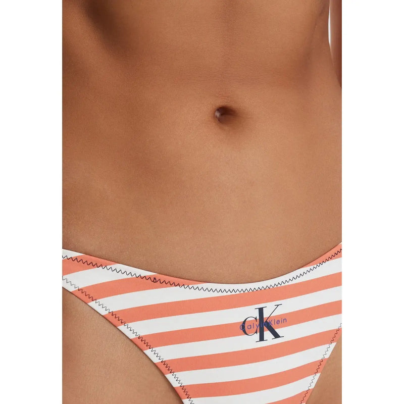 Coral and white striped calvin klein jeans bikini bottom with navy blue logo featuring a back side view