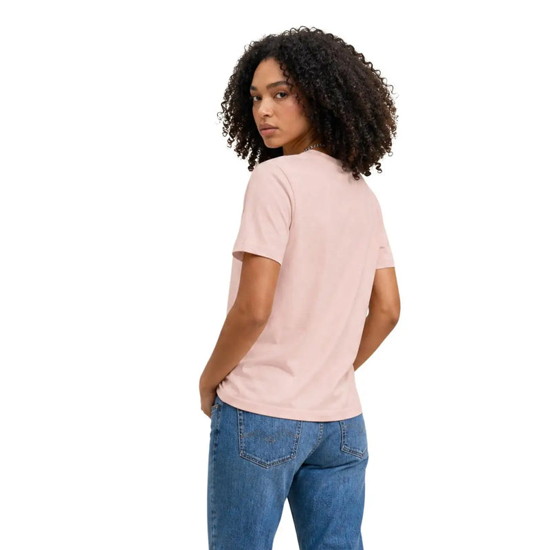 Calvin Klein Jeans T-shirt à manches courtes en coton rose poudré pour femme, avec un col rond.