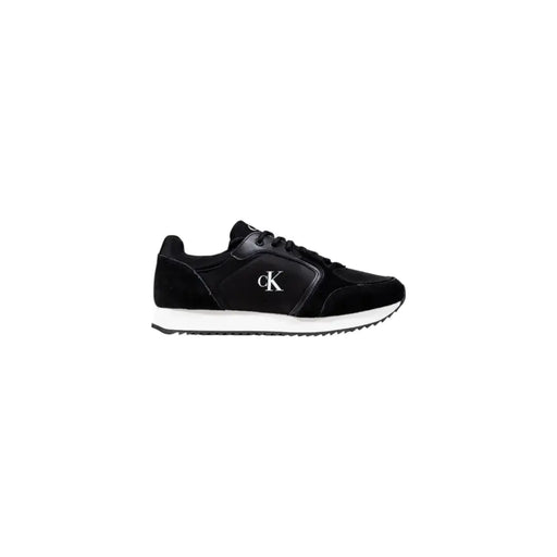 Calvin Klein Jeans women slip on black sneaker with suede and leather upper white rubber sole and silver logo