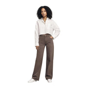 Brown wide-leg denim jeans paired with a Calvin Klein Jeans women white cotton long sleeve shirt front view