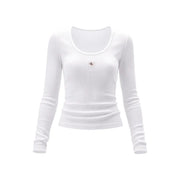 T-shirt blanc côtelé à manches longues en coton lycra top Pour femmes, avec un discret écusson Calvin Klein sur la poitrine