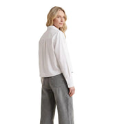 Calvin klein jeans women white cotton long-sleeved shirt with classic collar and subtle back pleats shown from the back