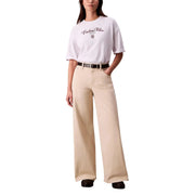 Beige wide-leg trousers in relaxed fit made from classic denim fabric paired with calvin klein jeans women white round neck short t shirt