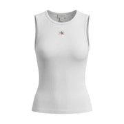 Calvin Klein Jeans débardeur blanc sans manches à col rond côtelé pour femme top avec un écusson logo rouge et noir sur la poitrine