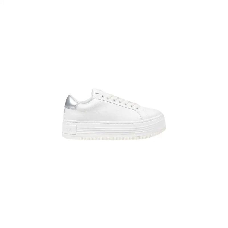 Calvin Klein Jeans women’s white leather platform sneaker with sleek minimalist design and metallic silver heel tab