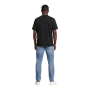 Calvin Klein T-shirt noir en coton à col rond et manches courtes pour homme, porté par un mannequin de face.