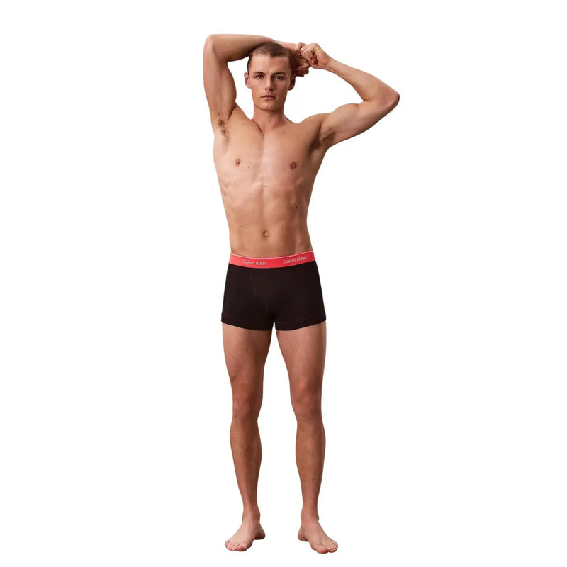 Black calvin klein men cotton trunks boxer briefs with a red waistband featuring the brand logo