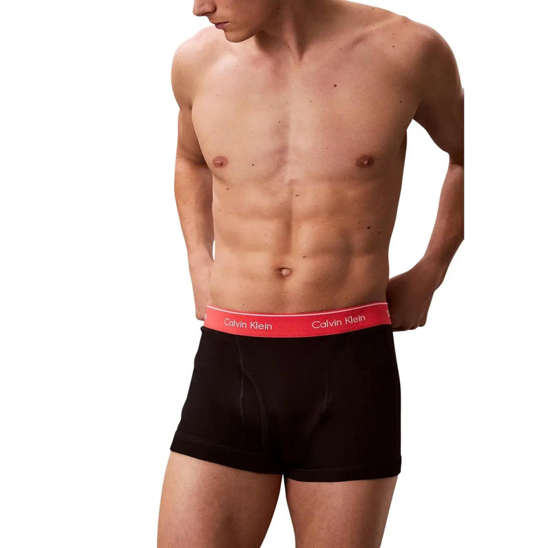 Black calvin klein cotton trunks with red waistband and white logo in a 3 pack for men