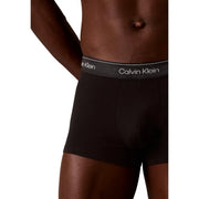 Calvin Klein men black cotton trunks with gray waistband featuring white logo in a 3 pack set