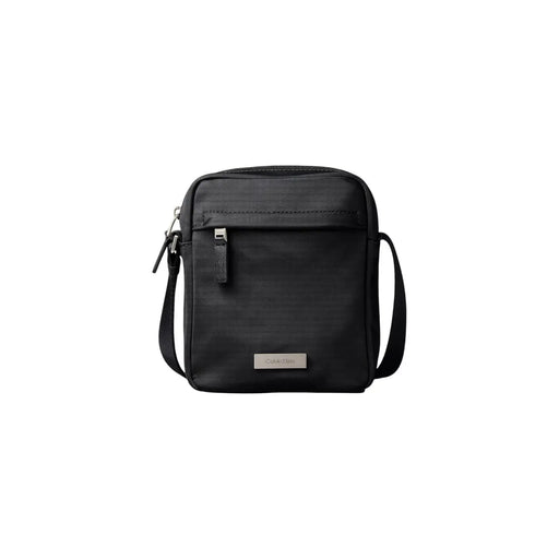 Calvin Klein Sacoche homme en nylon noir épuré, design minimaliste et tissu résistant, 16 x 20 x 6 cm
