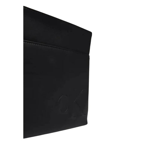 Portefeuille en cuir noir avec logo en relief assorti au sac bandoulière Calvin Klein pour homme en polyuréthane noir 19x21x4