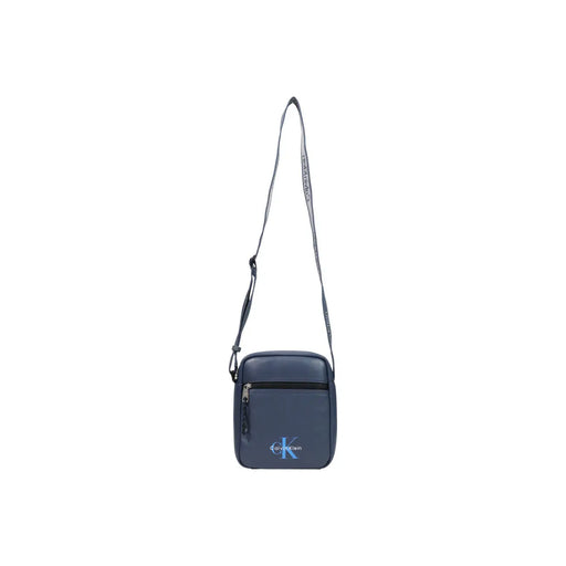 Sac bandoulière Calvin Klein pour homme, bleu foncé, logo discret et bandoulière ajustable, largeur 18 cm.