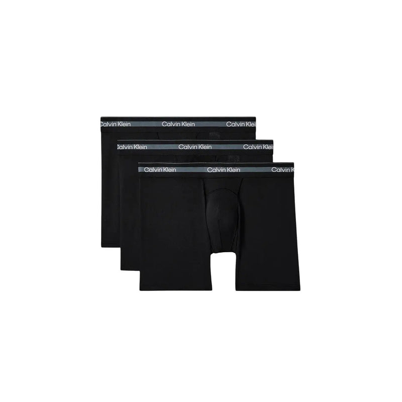 Boxer homme calvin klein noir en coton stretch avec une ceinture grise subtile portant le logo de la marque