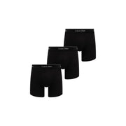 Boxer homme calvin klein noir en coton stretch avec ceinture logo blanche présentée à l'arrière