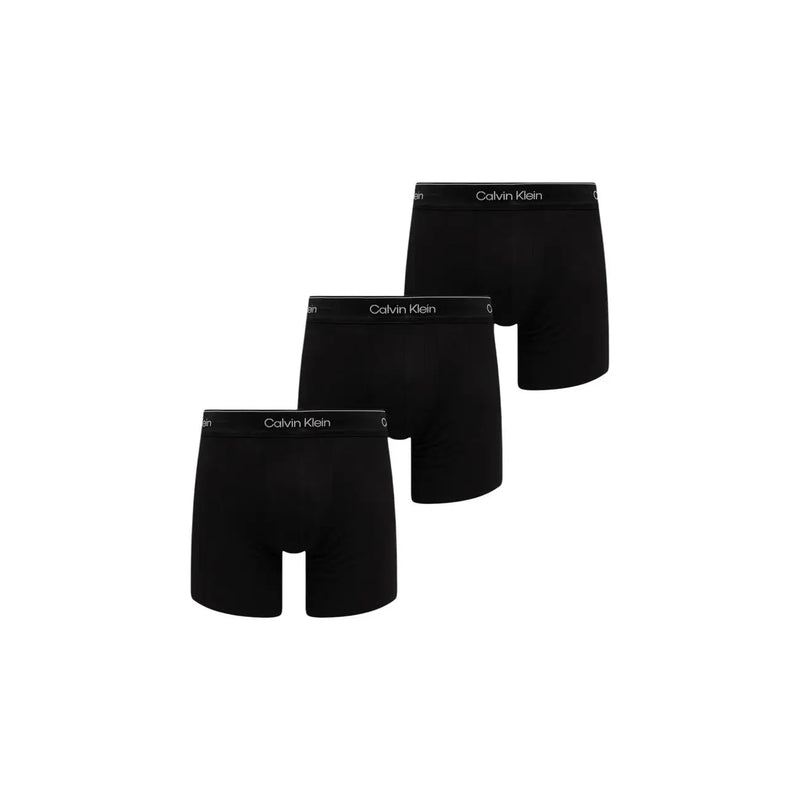 Boxer homme calvin klein noir en coton stretch avec ceinture logo blanche présentée à l'arrière