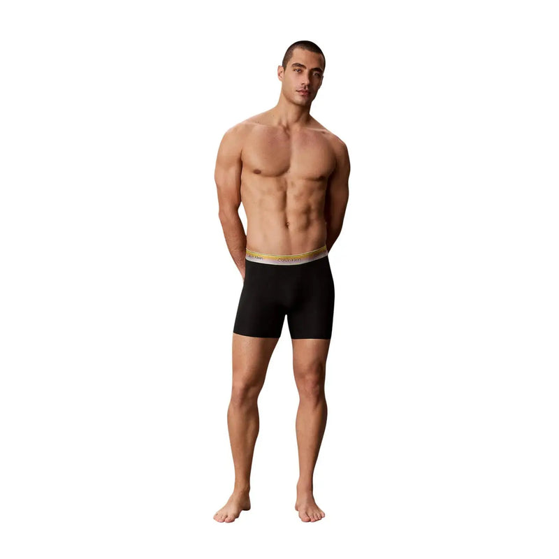 Black calvin klein men boxer briefs in cotton stretch with gold and white waistband for comfortable support