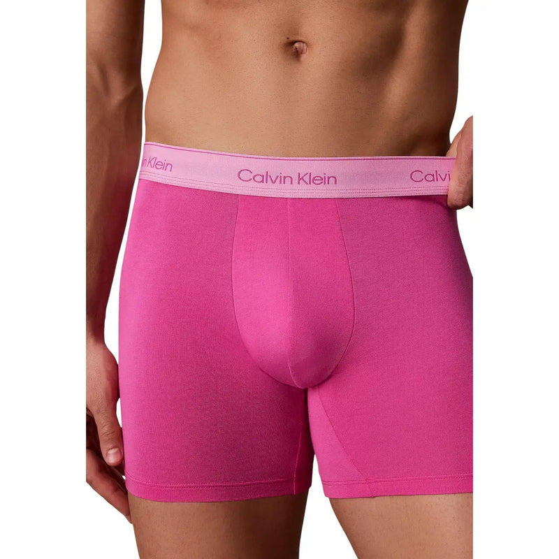 Bright pink Calvin Klein men boxer briefs with matching lavender logo waistband made of soft cotton in a 5 pack