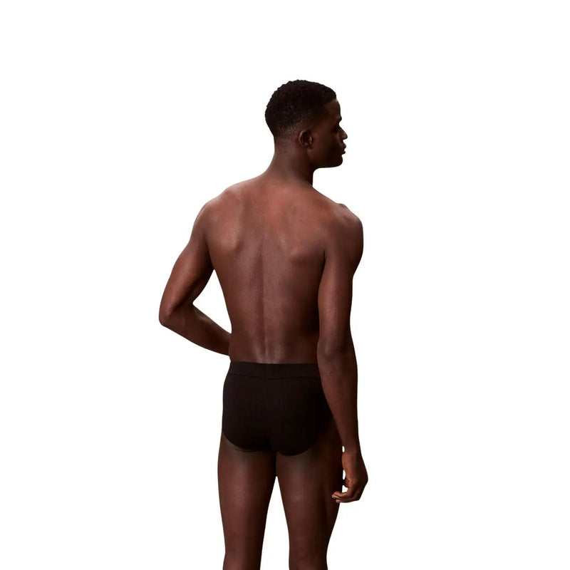 Calvin klein men cotton hip brief in black showing the front side of the comfortable underwear design