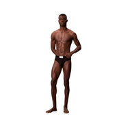 Black cotton calvin klein men hip brief with white label on waistband showing front side