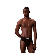 Black calvin klein men cotton hip brief featuring a white waistband label and comfortable breathable fabric