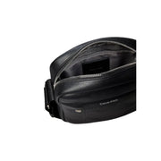 Sac bandoulière Calvin Klein en cuir noir texturé avec fermeture éclair argentée, modèle reporter, dimensions L 16 x H 20 cm