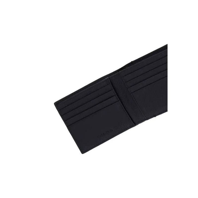 Calvin Klein Portefeuille zippé en cuir noir pour homme, avec plusieurs emplacements pour cartes et un design minimaliste mesurant 7 x 9 cm.