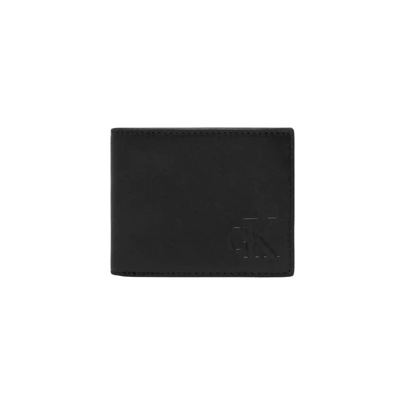 Portefeuille homme Calvin Klein en cuir noir 11x9cm avec logo discret en relief sur le devant.