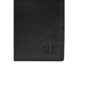 Calvin Klein men leather wallet black with embossed ck logo measuring 11x9x2 cm shown from the back side