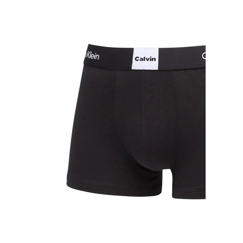 Black Calvin Klein boxer briefs with white logo waistband designed for men underwear in the Calvin Klein collection