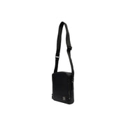Sac bandoulière Calvin Klein pour homme, en polyuréthane noir, au design minimaliste et élégant, avec bandoulière ajustable.