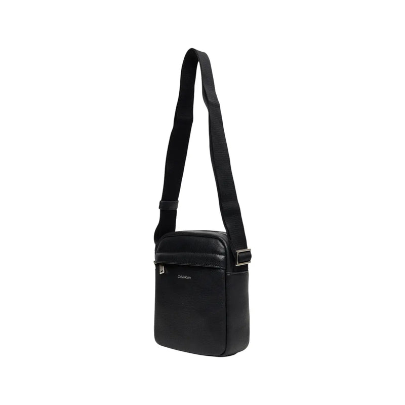 Calvin Klein Sac bandoulière homme en cuir noir avec poches zippées et finitions argentées, dimensions : 18 x 23 x 7 cm