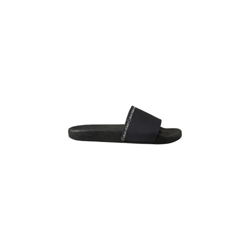 Pantoufles Calvin Klein noires pour homme, sandales à enfiler en polyuréthane, design minimaliste et élégant, logo blanc sur la bride