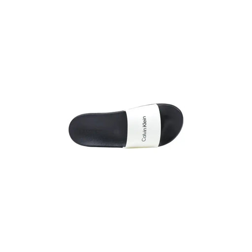 Noir et blanc Calvin Klein pantoufles pour hommes noires à bout ouvert, sandale à enfiler avec un design minimaliste en polyuréthane