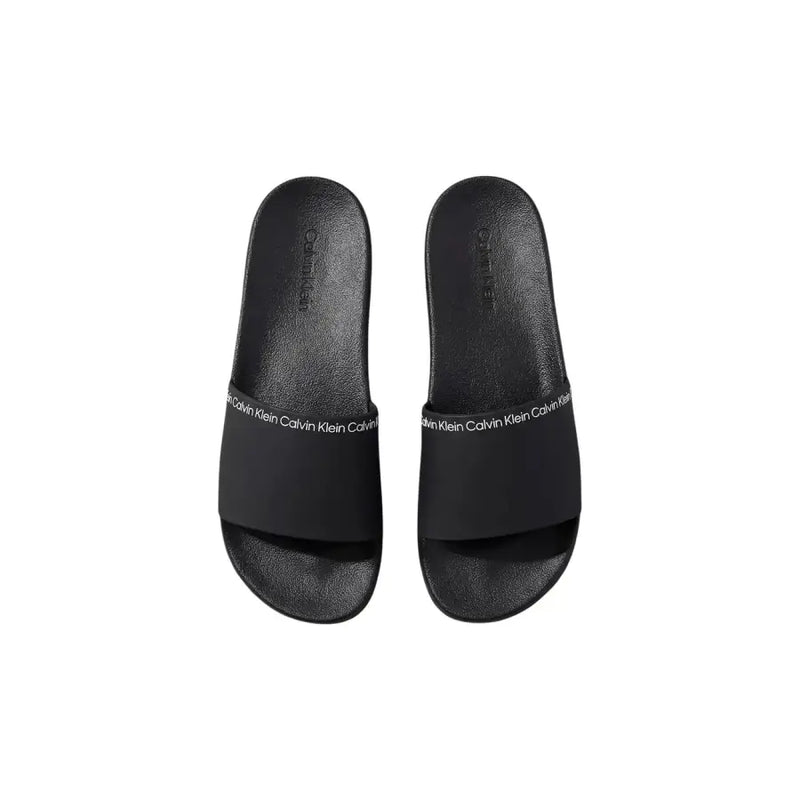 Pantoufles noires Calvin Klein pour homme, à bout ouvert, en polyuréthane, avec logo emblématique sur la bride