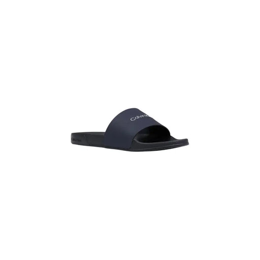 Calvin Klein Sandales à enfiler pour homme en polyuréthane noir, au design minimaliste et ornées d'un logo blanc discret sur la bride.
