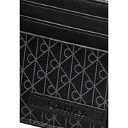 Calvin Klein Portefeuille homme noir avec porte-cartes, motif géométrique discret et finitions en cuir cousues.