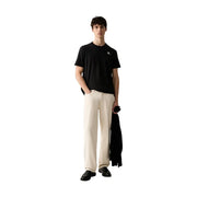 Calvin Klein T-shirt noir en coton pour homme, coupe classique, avec un petit logo blanc sur le devant de la poitrine.