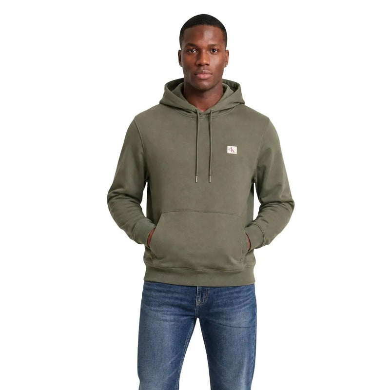 Calvin Klein mens green cotton hoodie sweatshirt with olive green fabric, small white logo patch, and matching drawstrings