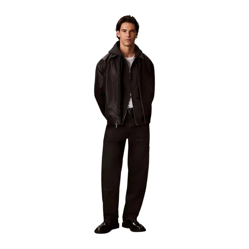 Black leather bomber jacket with hood and front zipper shown with calvin klein mens grey cotton hooded sweatshirt
