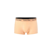 Beige calvin klein mens boxer briefs with black waistband featuring repeating white logo designed for low rise fit
